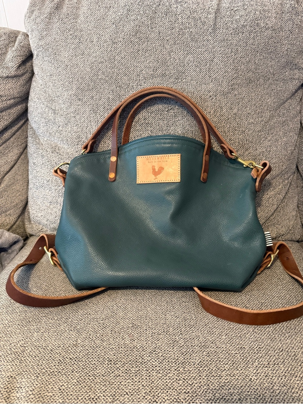 Meanwhile Back on the Farm green leather backpack